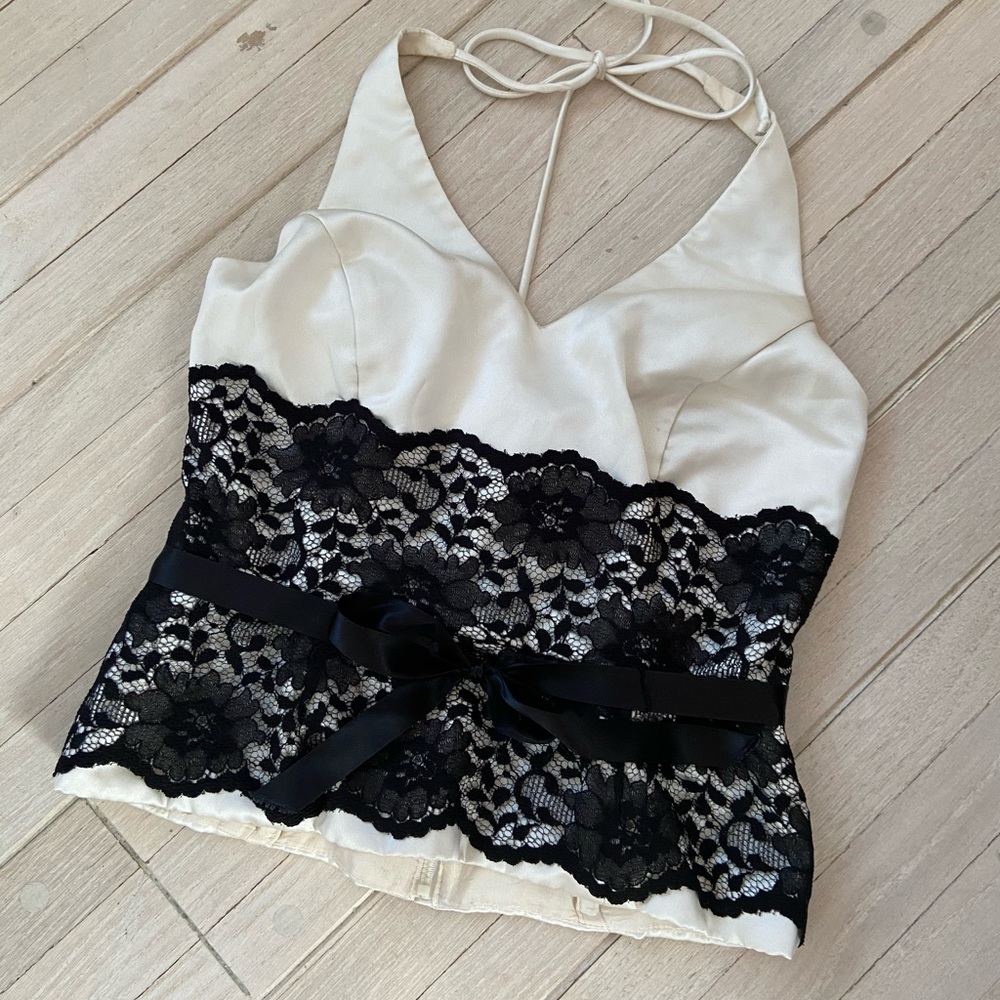 Woman’s beige halter top with black lace